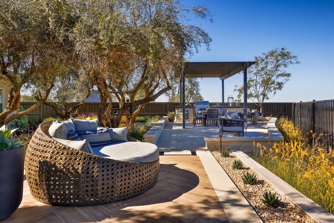 outdoor living area with grill and comfortable seating