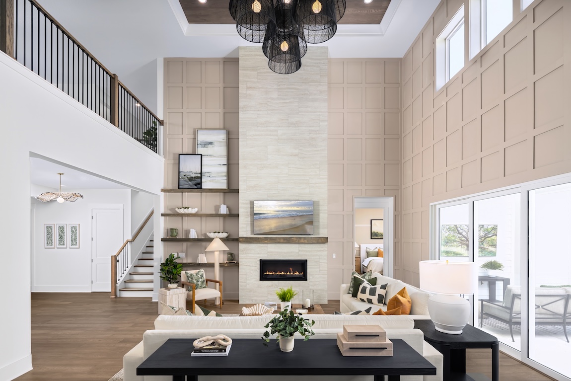 luxury two-story great room with fireplace and accent walls