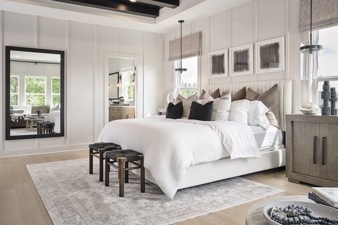 primary bedroom with neutral colors and access to the bathroom