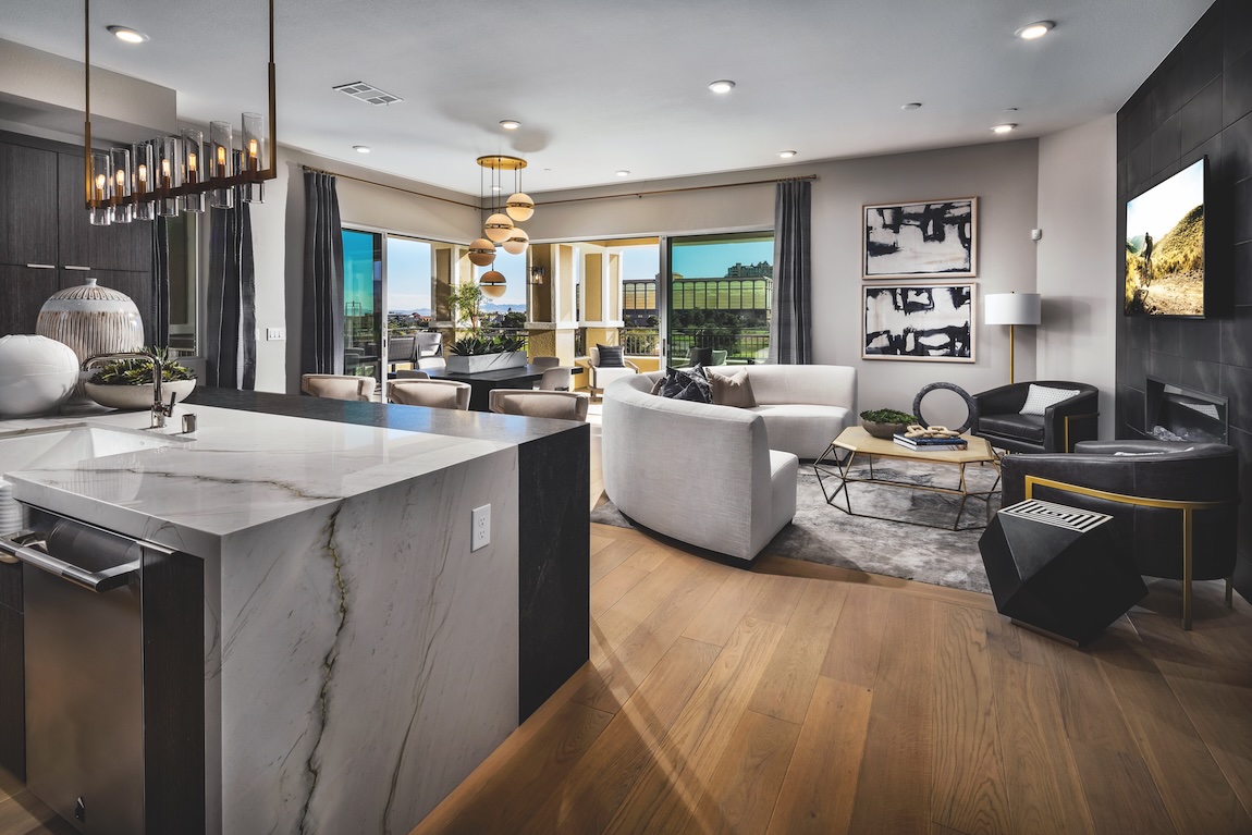 kitchen and great room with marble waterfall island