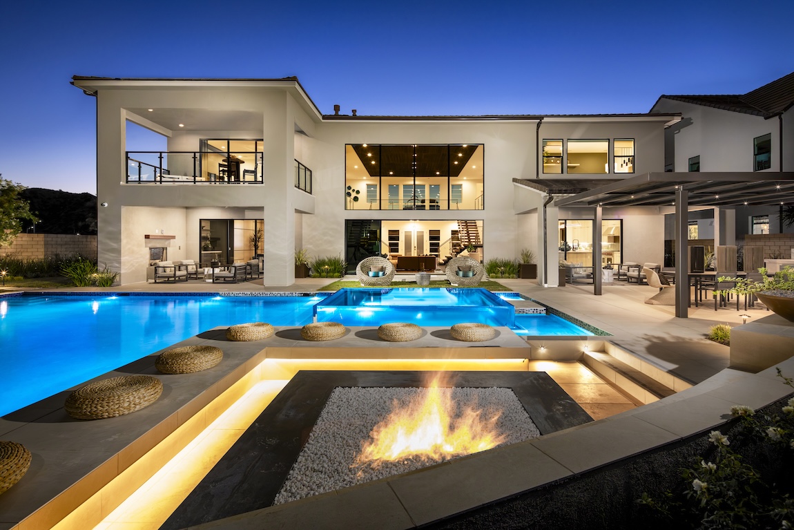 outdoor living space with pool and fire pit