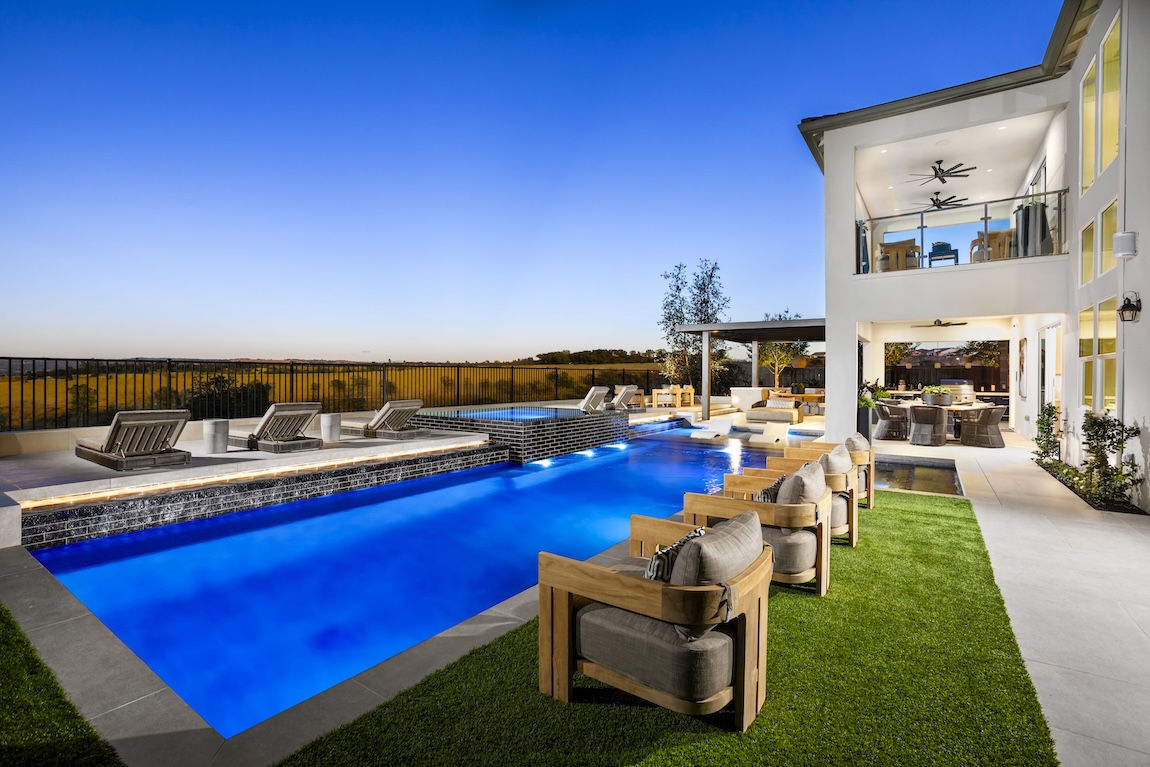 outdoor living area with pool and seating spots