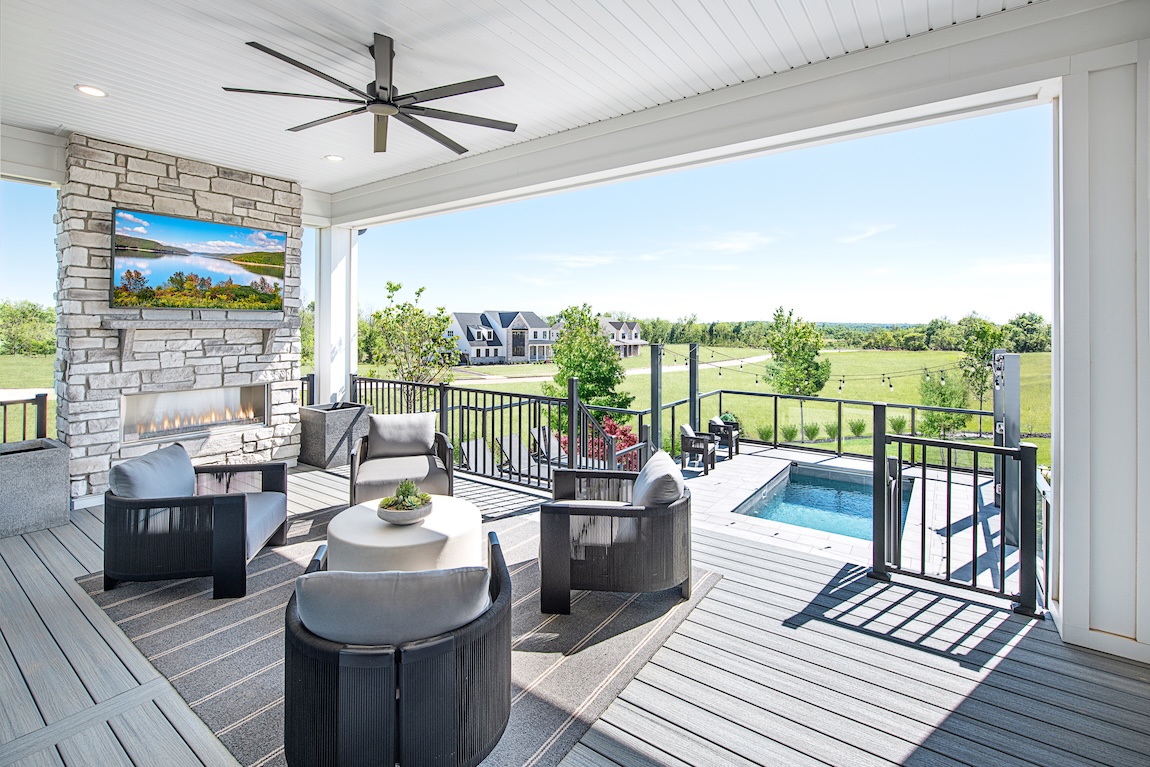 outdoor patio overlooking pool and greenery