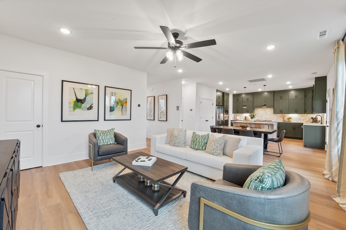 living room and kitchen with green cabinets