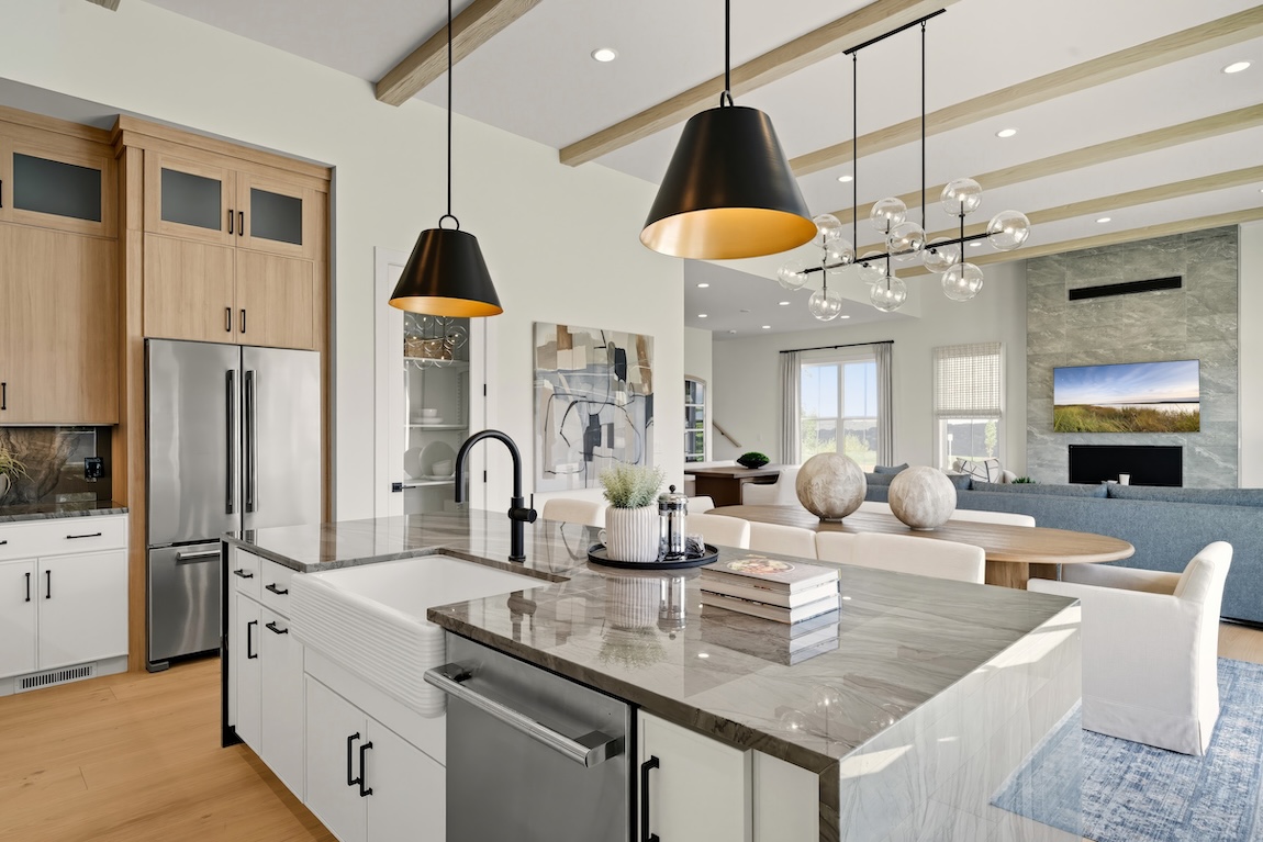 modern kitchen leading to dining and living space.