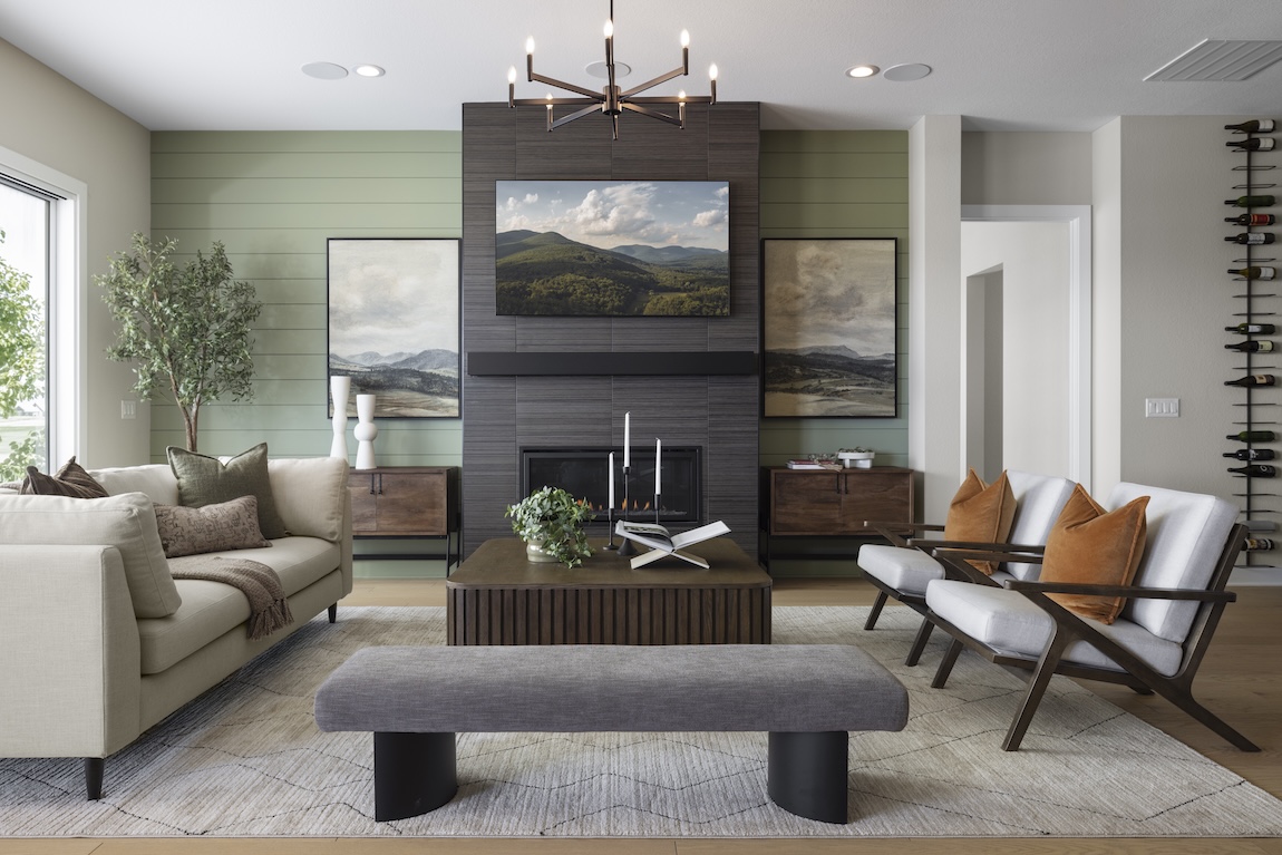 modern great room with green accent wall.