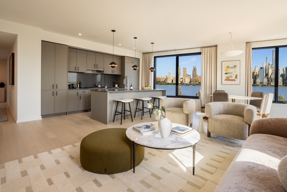 living room and kitchen space with neutral colors