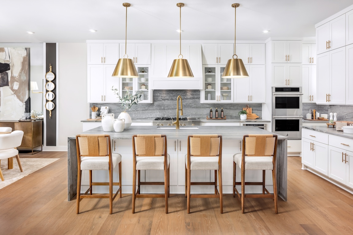 modern kitchen with wooden features and gold fixtures