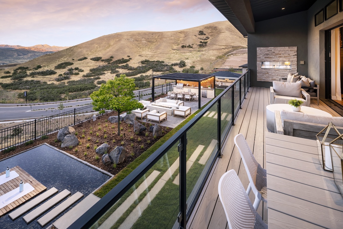 luxury outdoor living space with pool and outdoor kitchen.