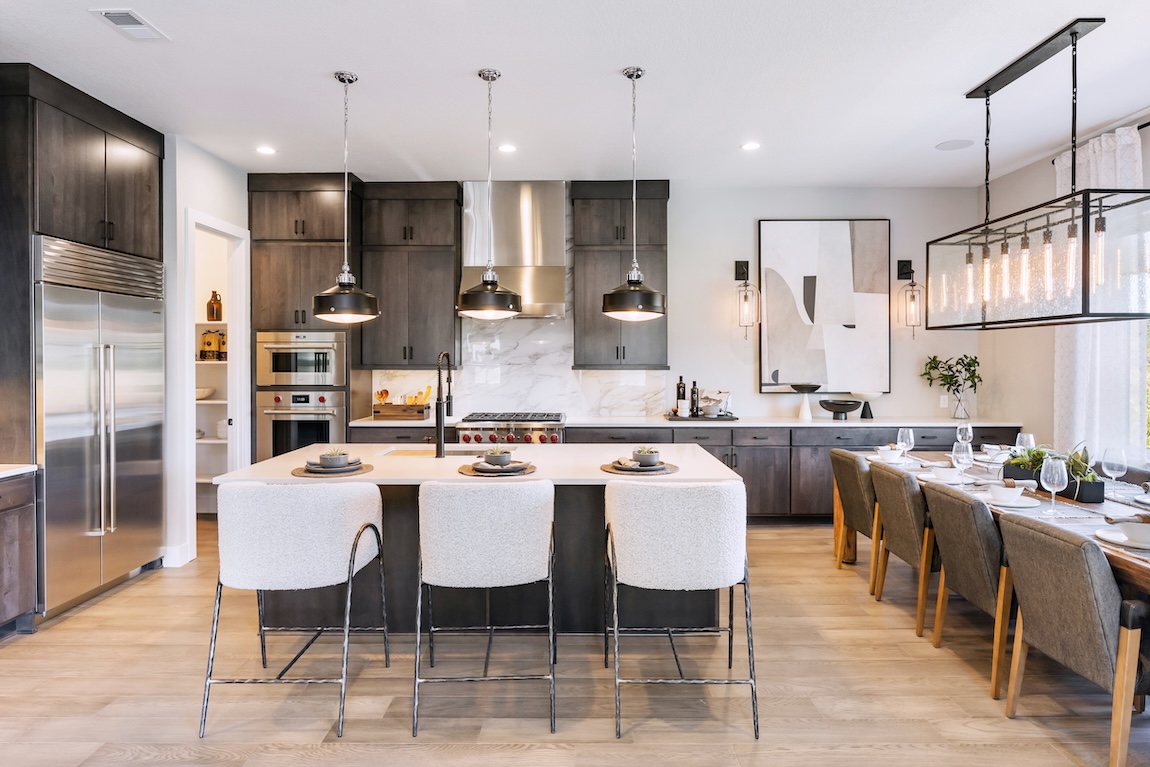 modern kitchen with white island and seating.