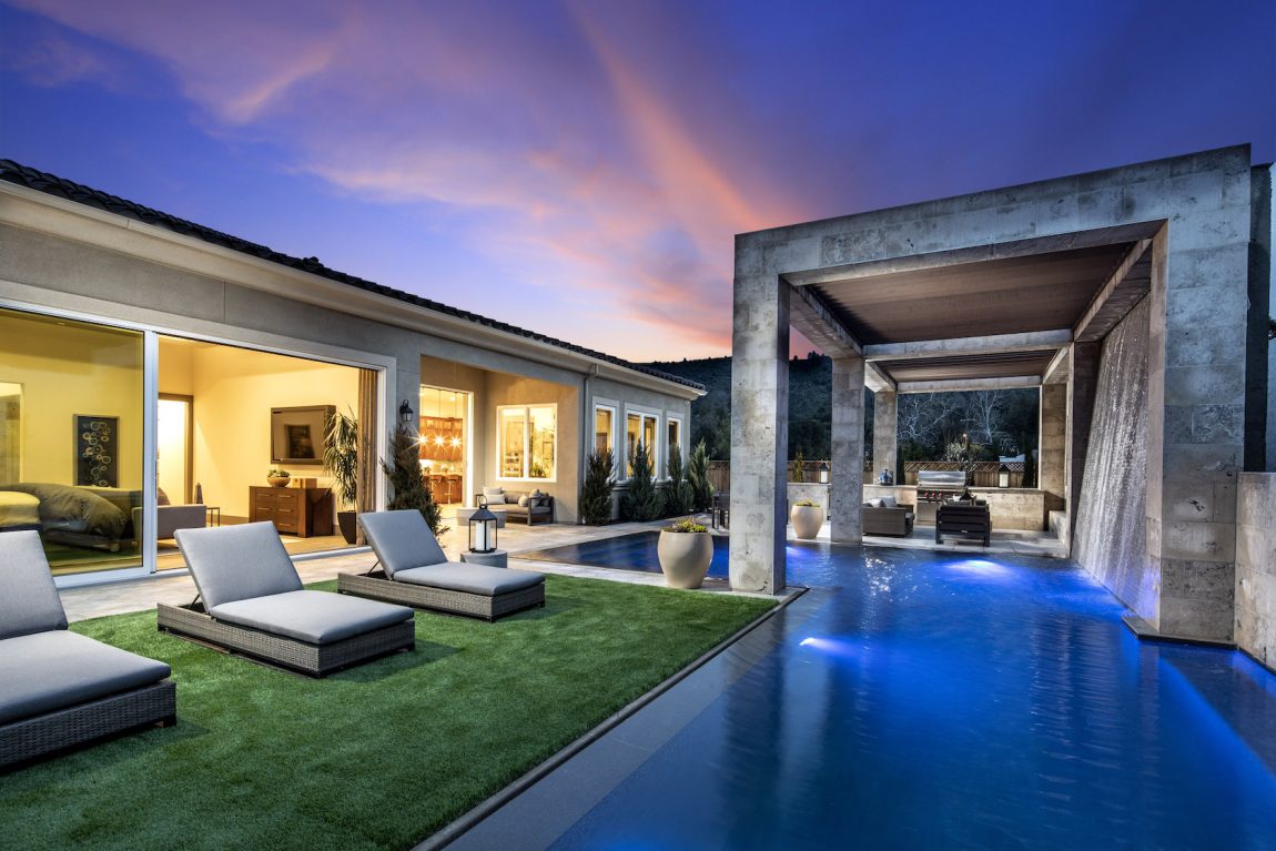 Outdoor pool area with lounge chairs.