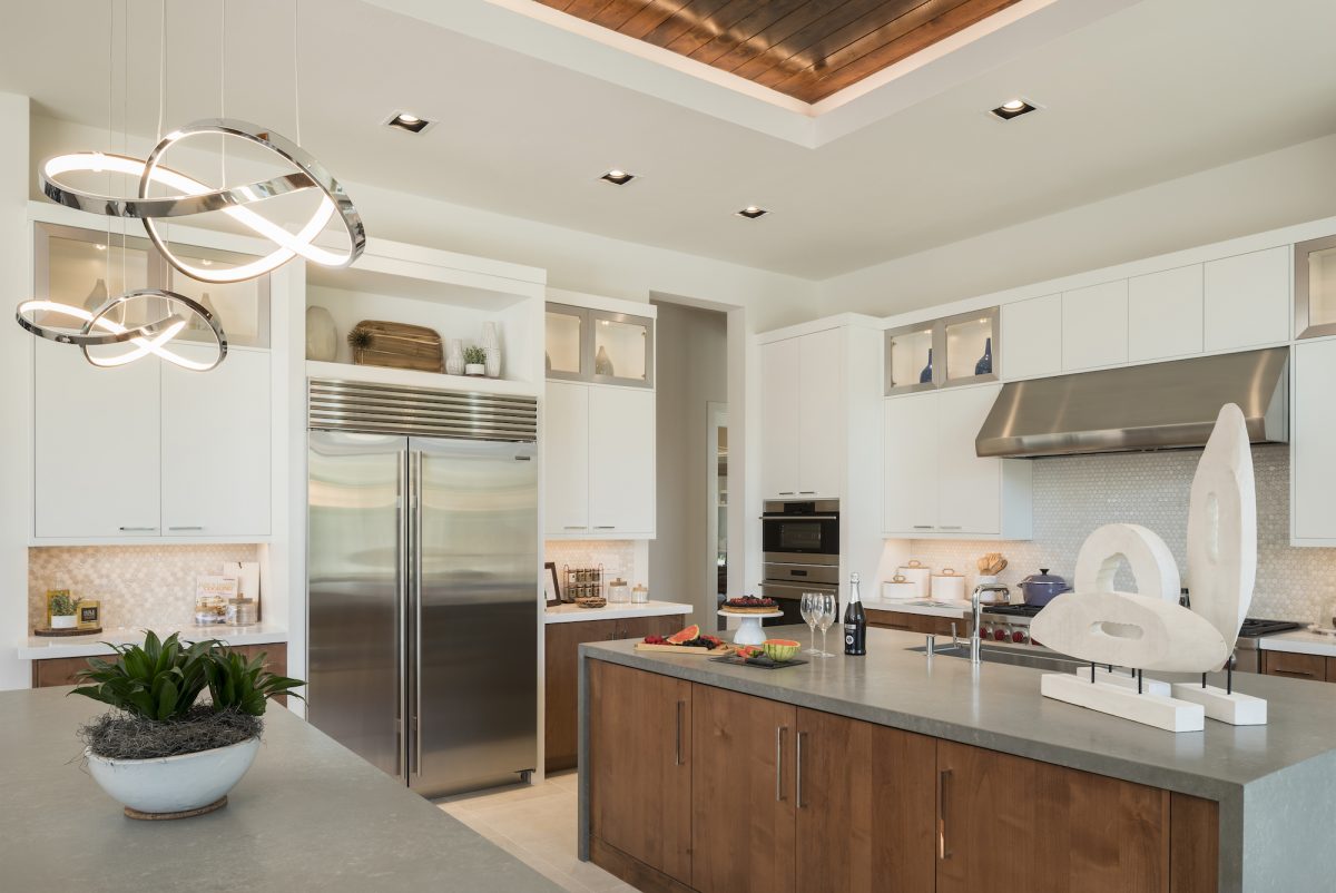 Toll Brothers kitchen with white cabinets and stainless steel appliances