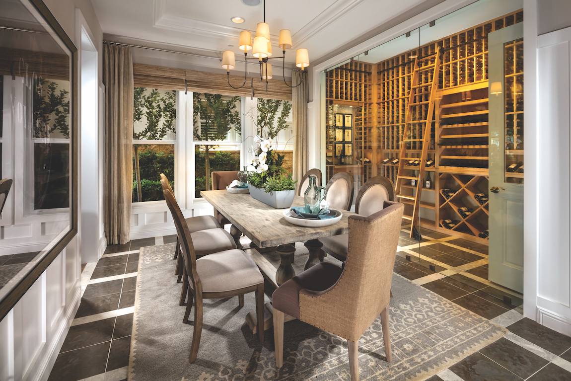 A floor to ceiling, climate controlled wine cellar encased in glass