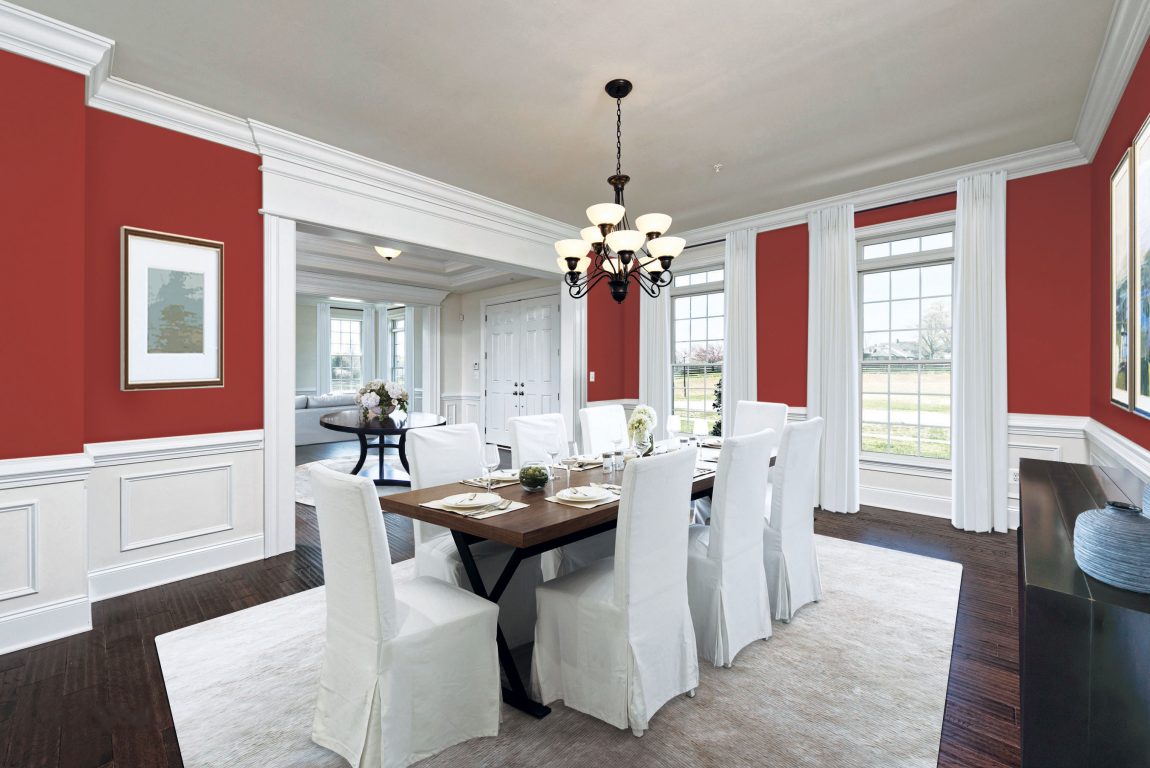 Dining room with rave red color paint.