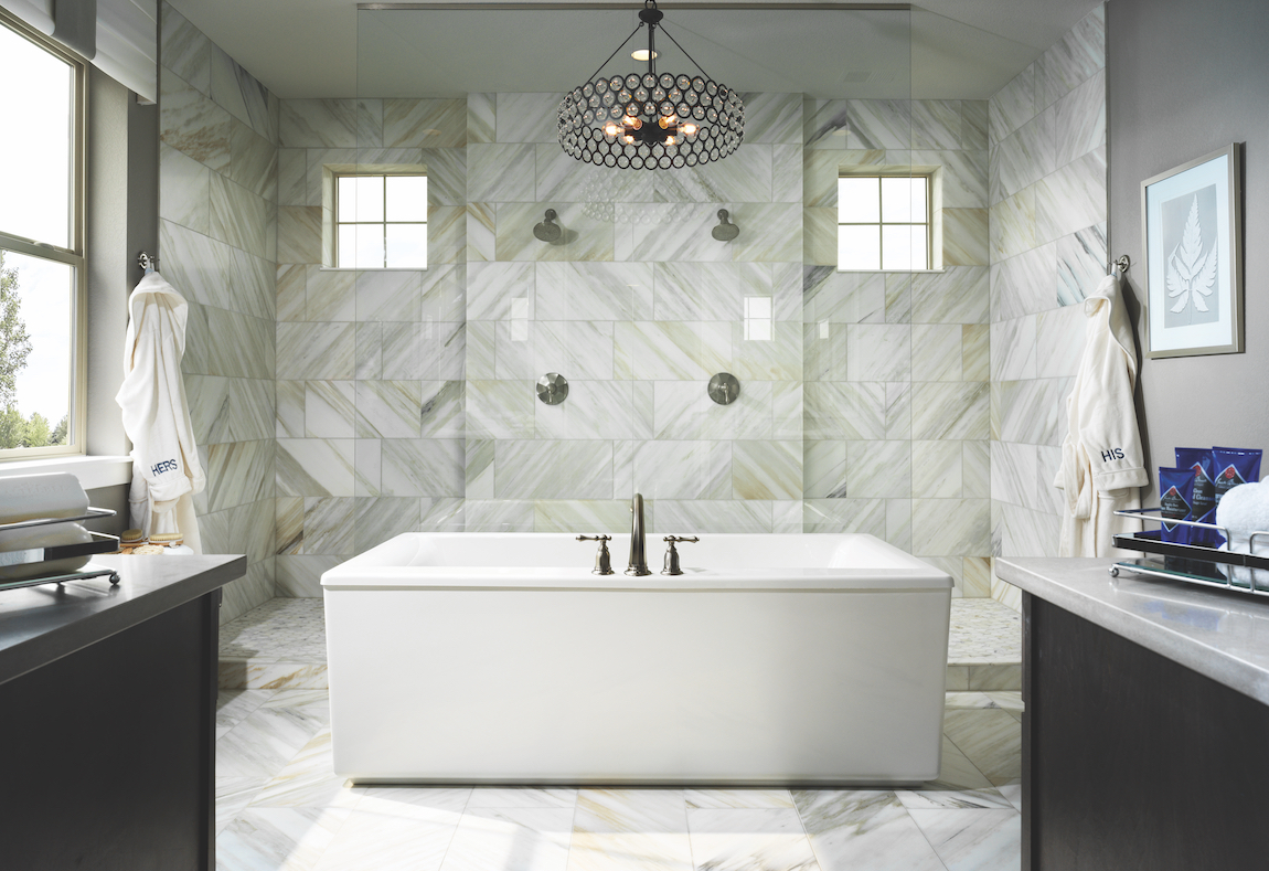 A modern bathroom with mixed metal design elements.
