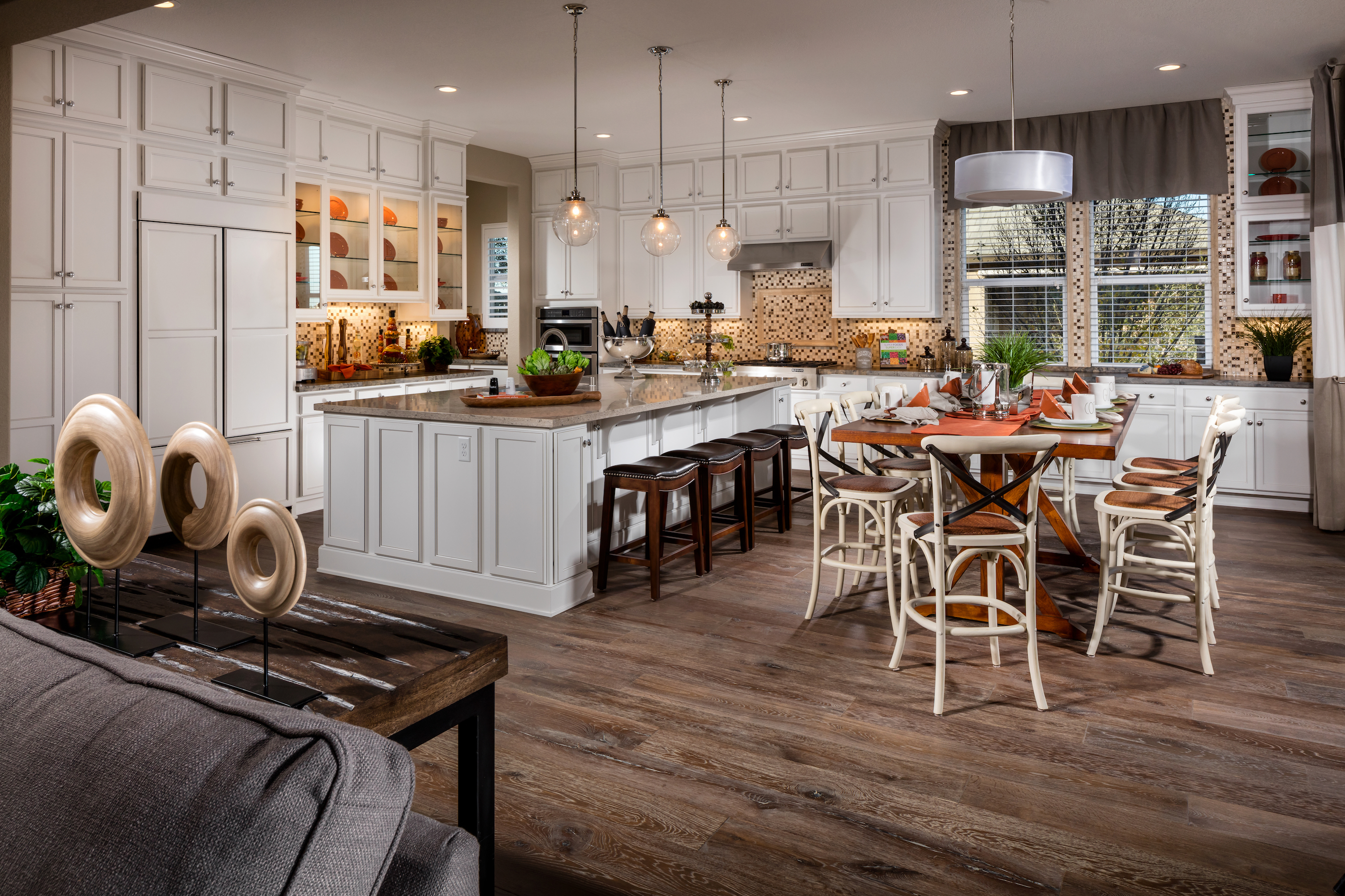 Kitchen with wood floors and white cabinets