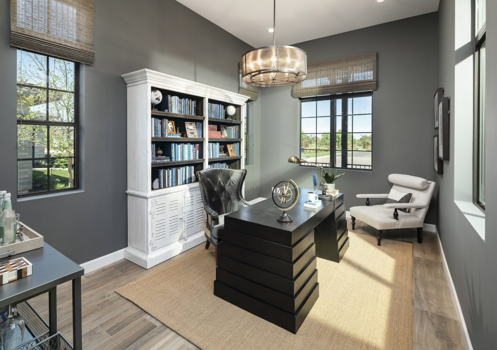Home office with grey colored walls.