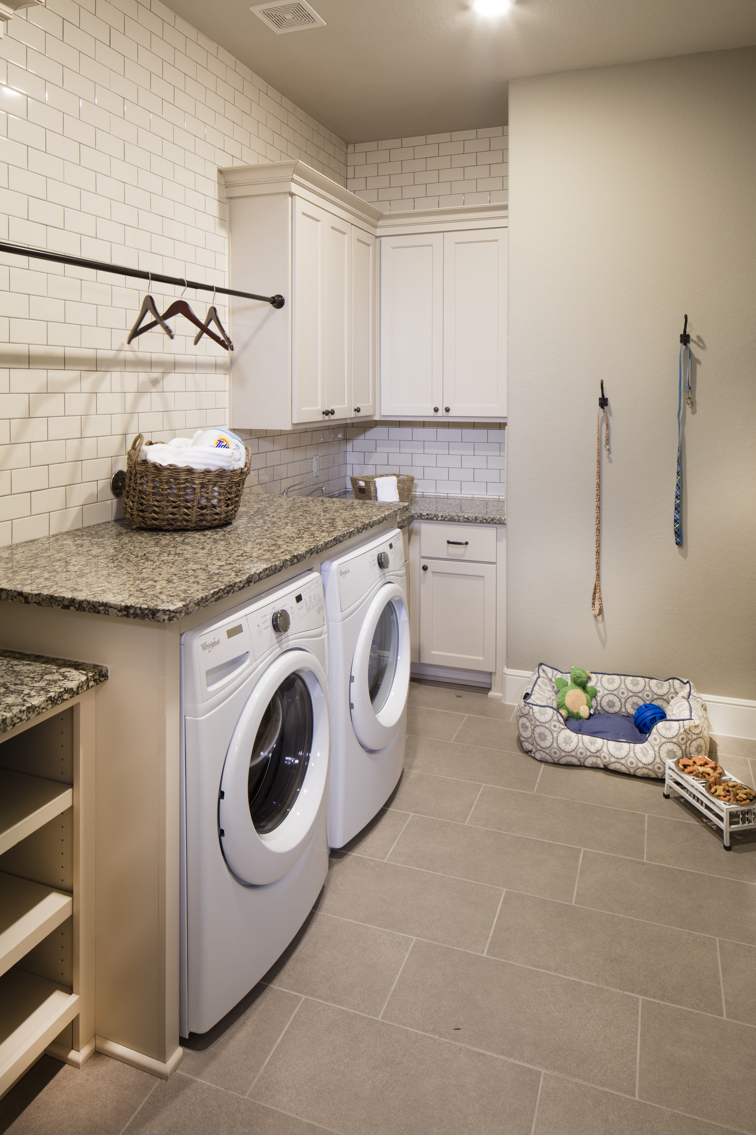 Laundry room with a dog bed.