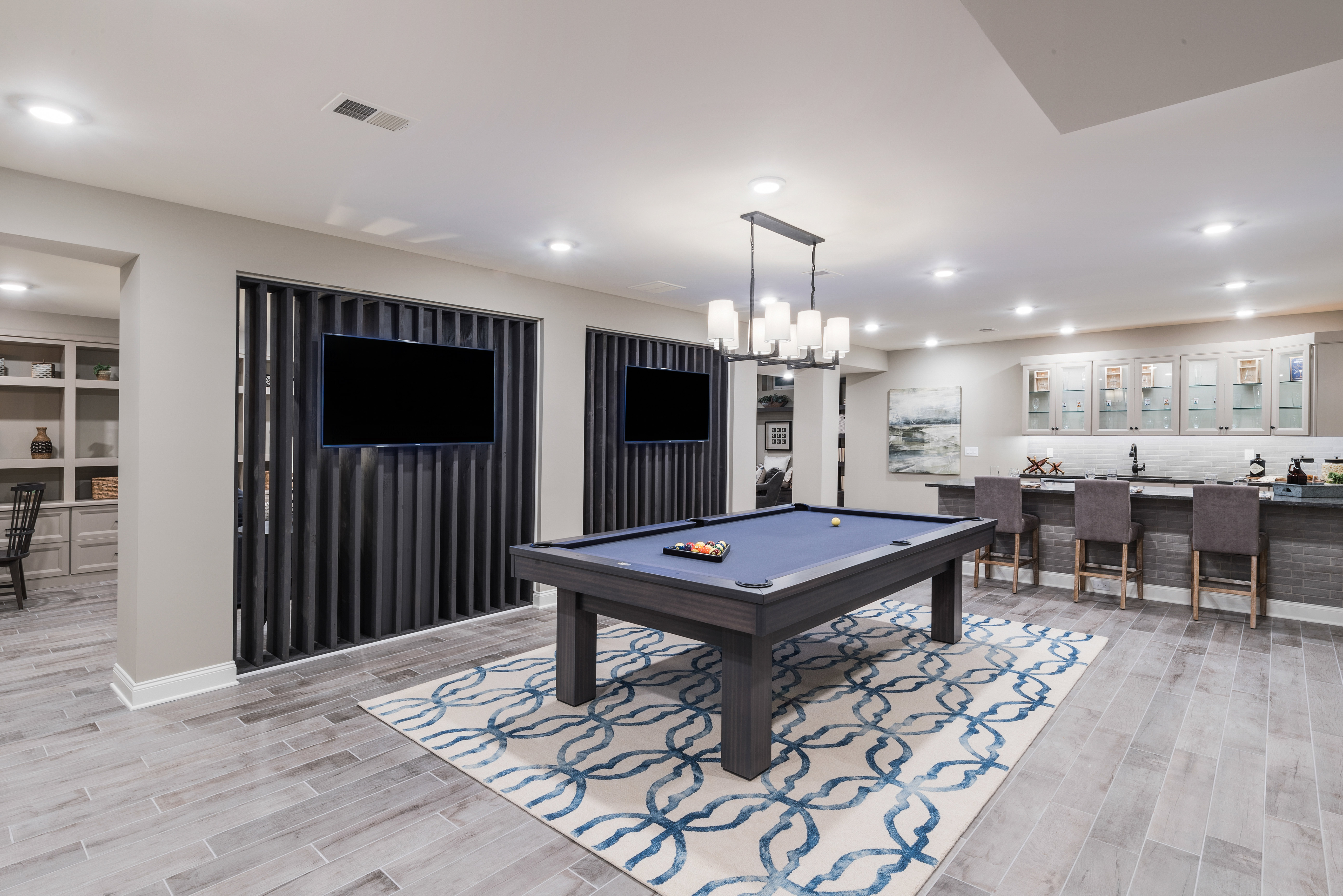 Pool Table and Bar Furnished in a Finished Basement