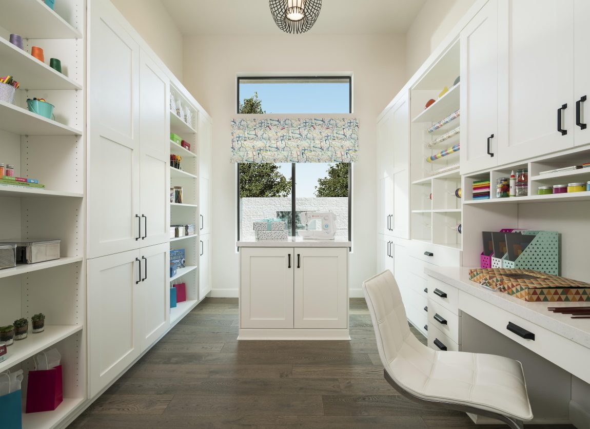 Craft room with white cabinets 