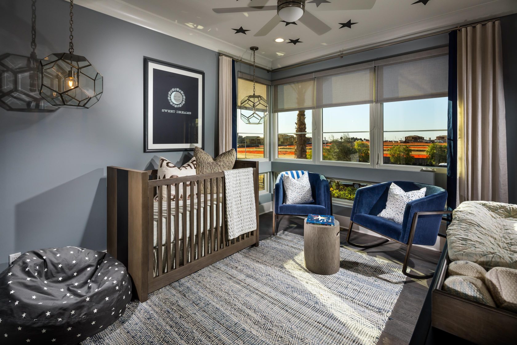 Nursery with grey color walls.