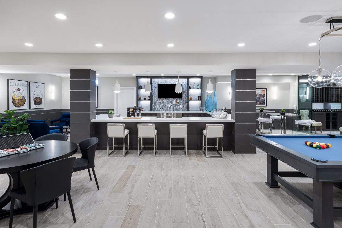 Basement with a bar and game room