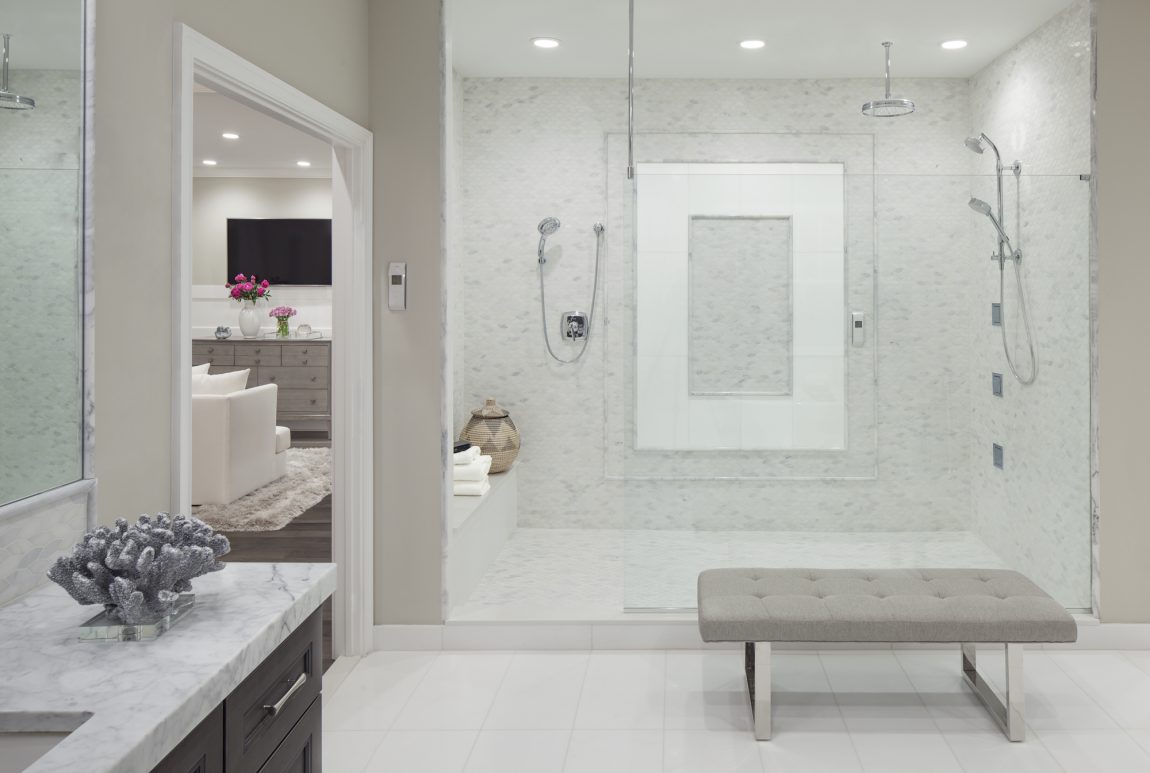 Large shower with a picture frame tile.