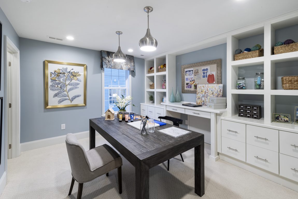 Craft room with black table and blue walls