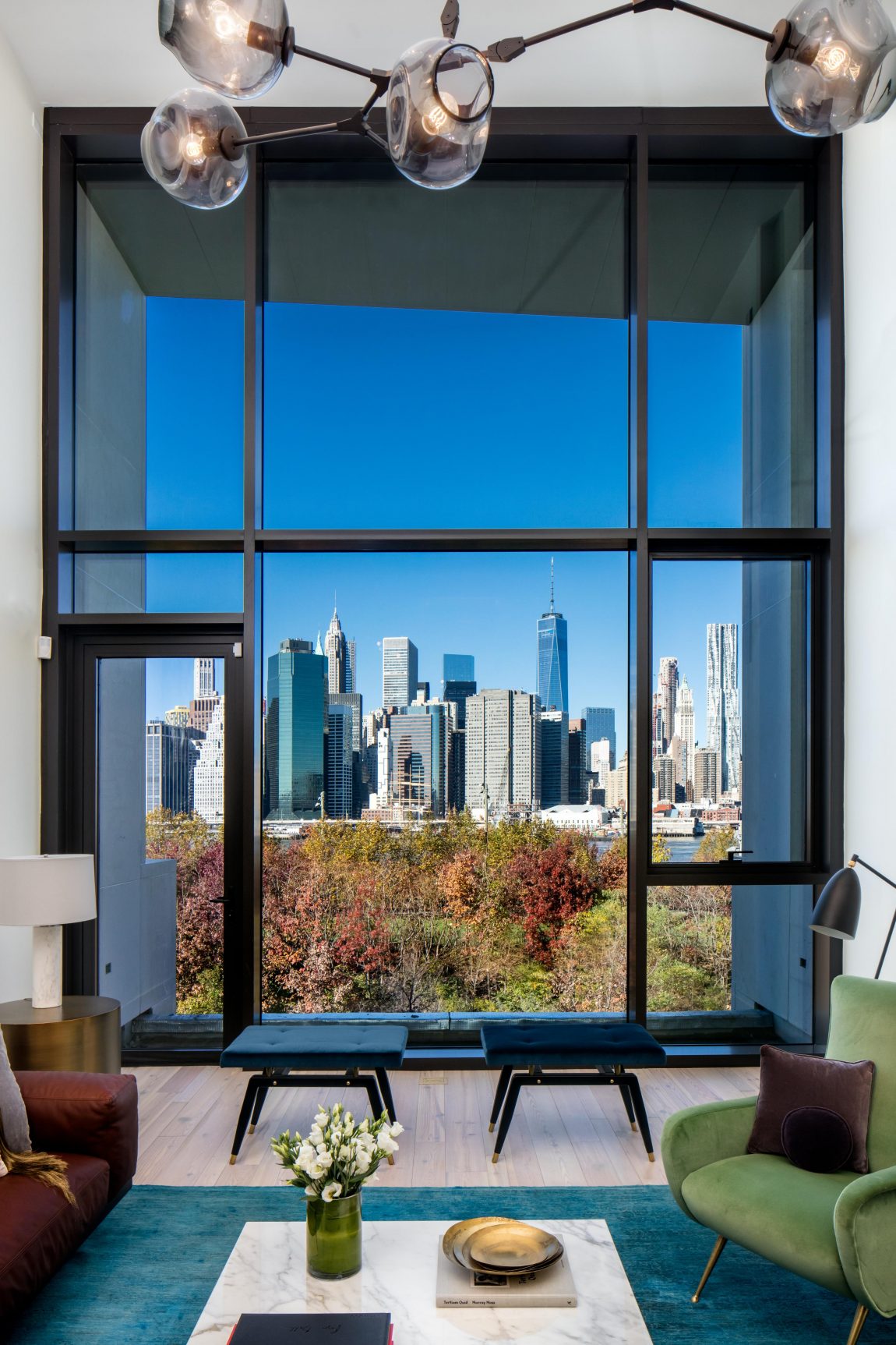 A grand living room window, and a view of New York City., 