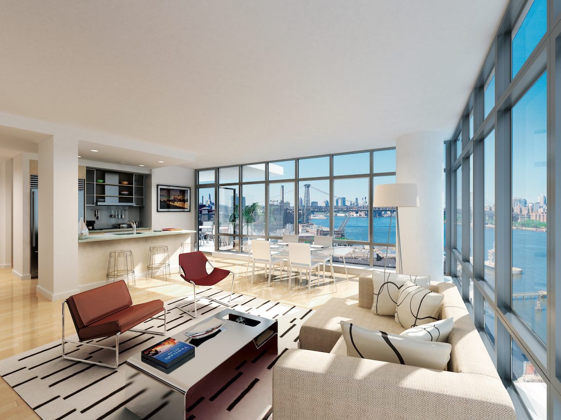 Living room with nautral lighting, floor to ceiling windows and a view of New York City. 