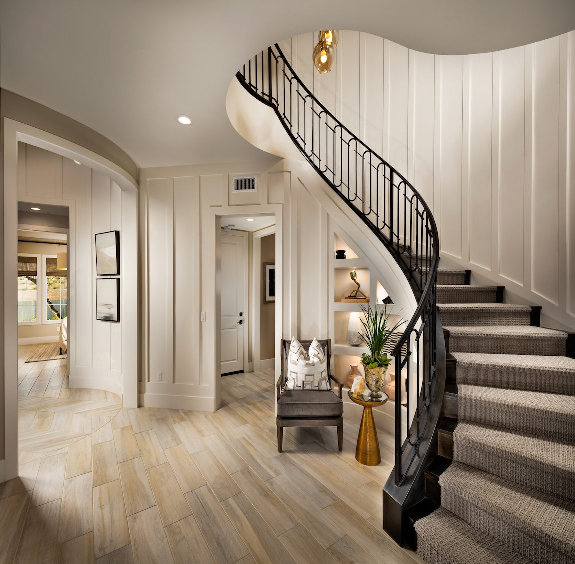 Table under the stairs with paneled walls