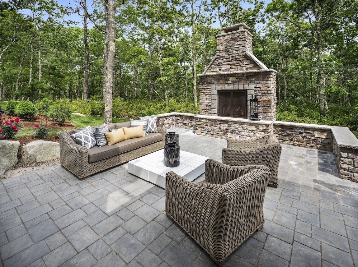 Outdoor fireplace with seating area. 