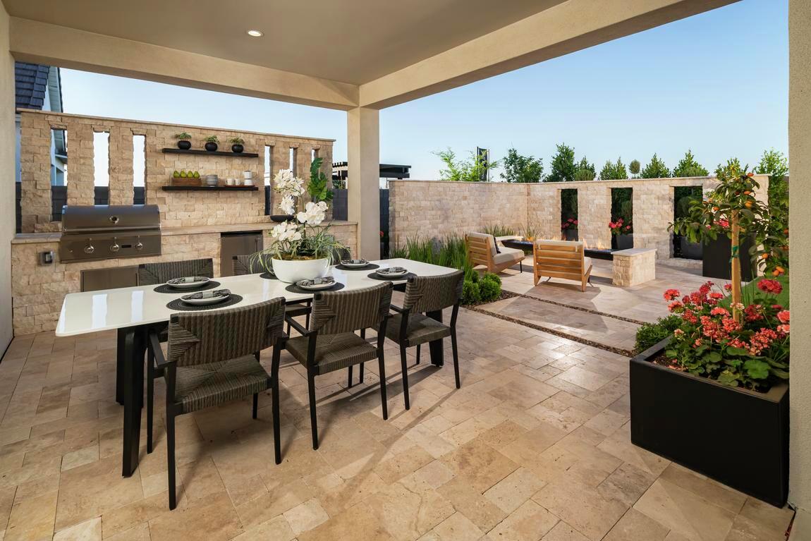 outdoor eating area with large patio and tan accents