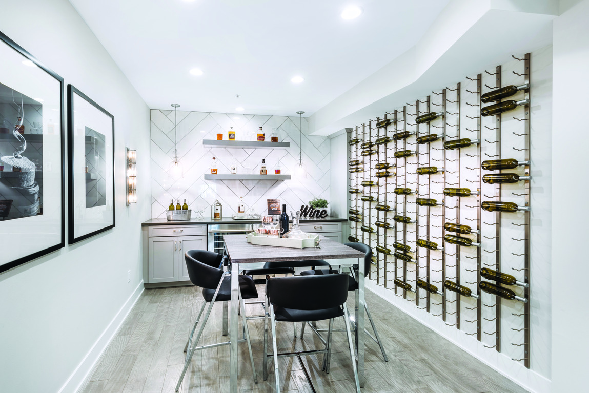 Wine storage and kitchen in finished modern basement