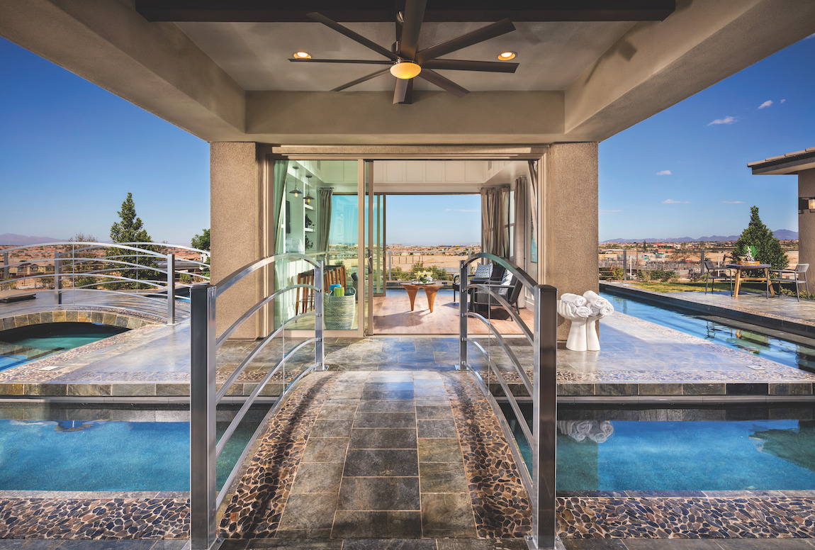 Outdoor bridge that leads to pool area and pool house.