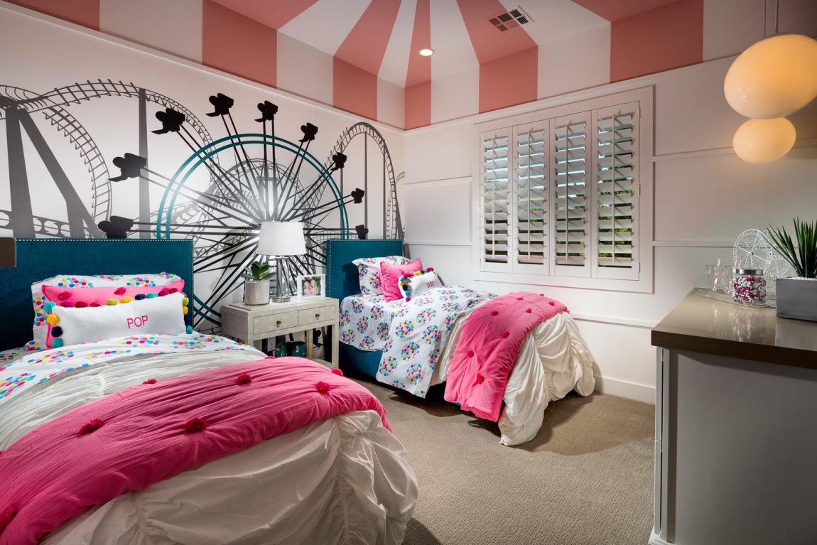 Shared kids room featuring imaginative amusement park theme.