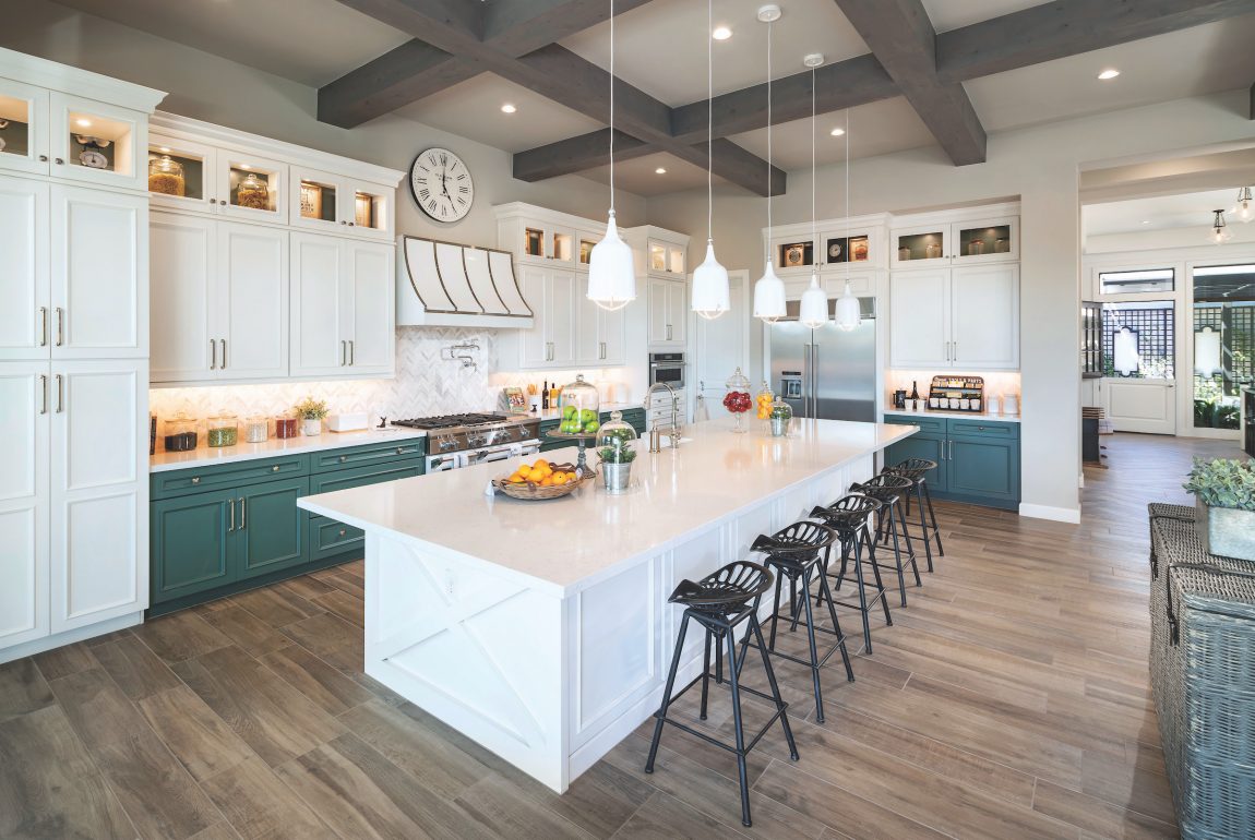 Expansive kitchen featuring large island and pendant island lighting