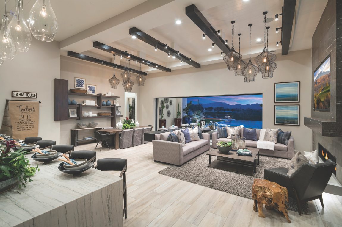 open-concept great room with beamed ceiling.