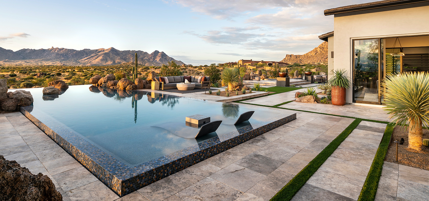 Luxury backyard in an Arizona home with a sitting area and a pool.