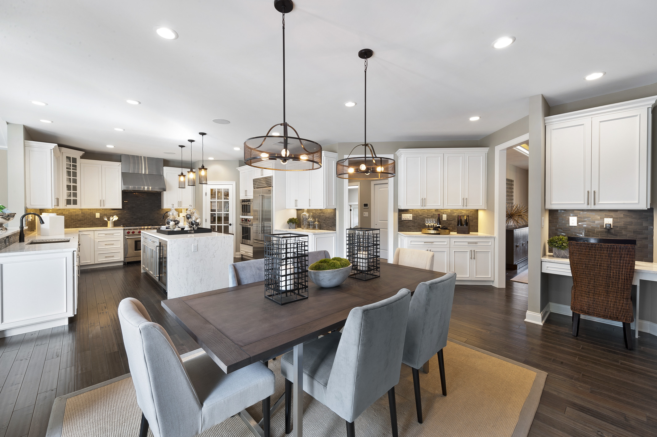 Dining space highlighted by matching pendant fixtures.