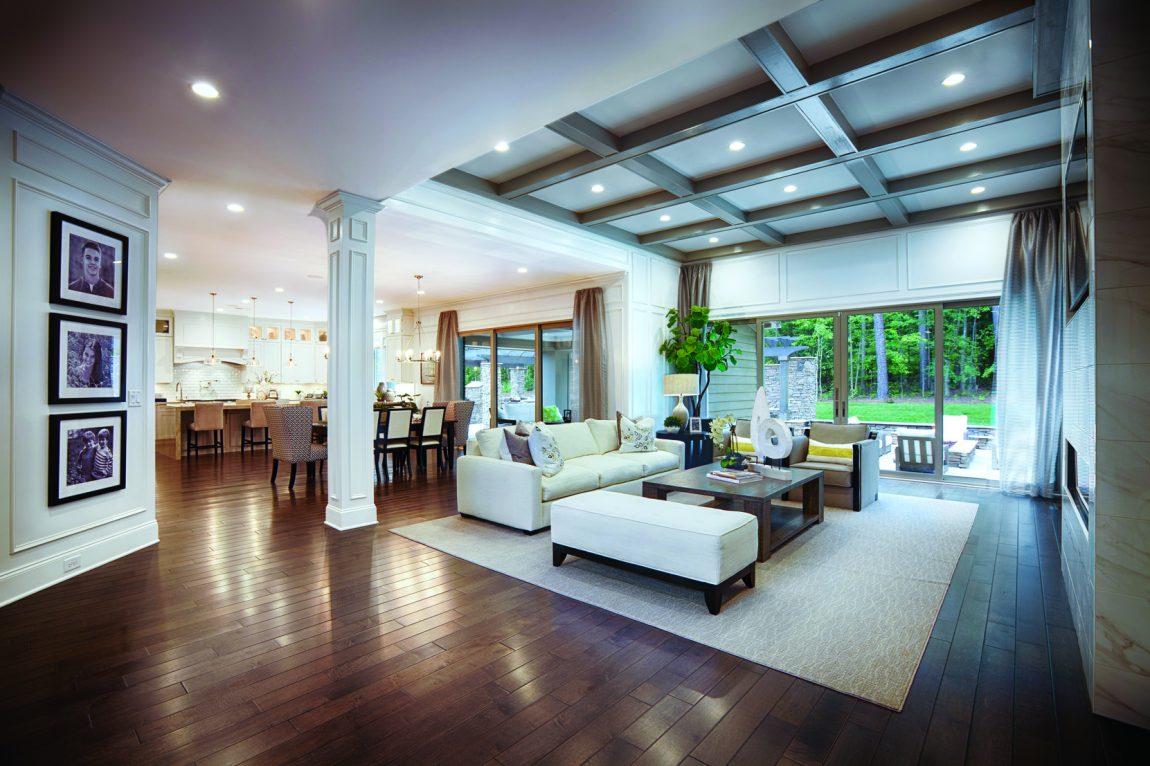 Open-concept family room featuring coffered ceiling.