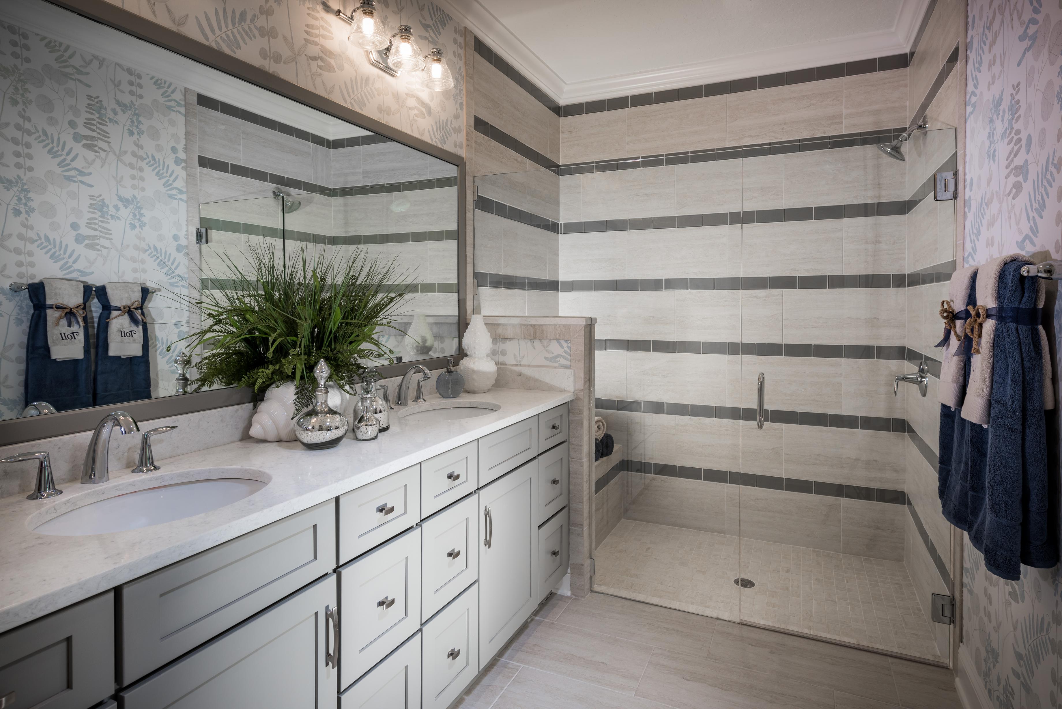 Vanity and walk-in shower with horizontal tiling