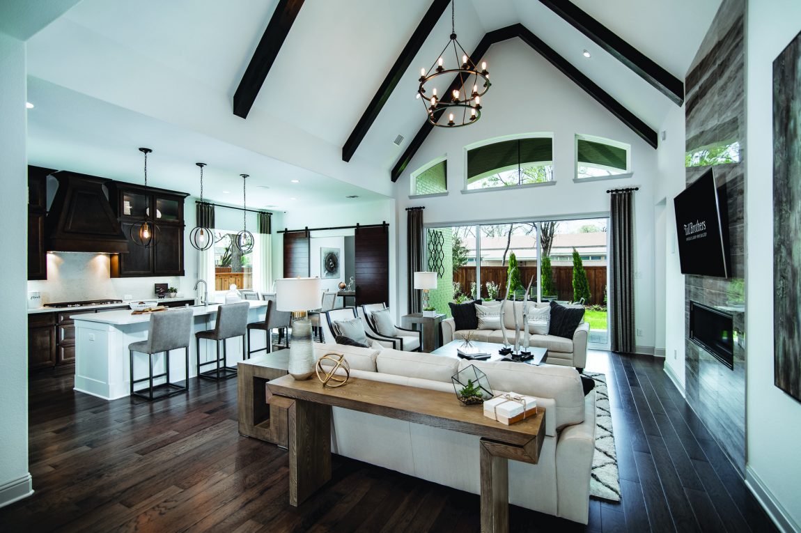 Open-concept living room featuring vaulted beam ceiling.