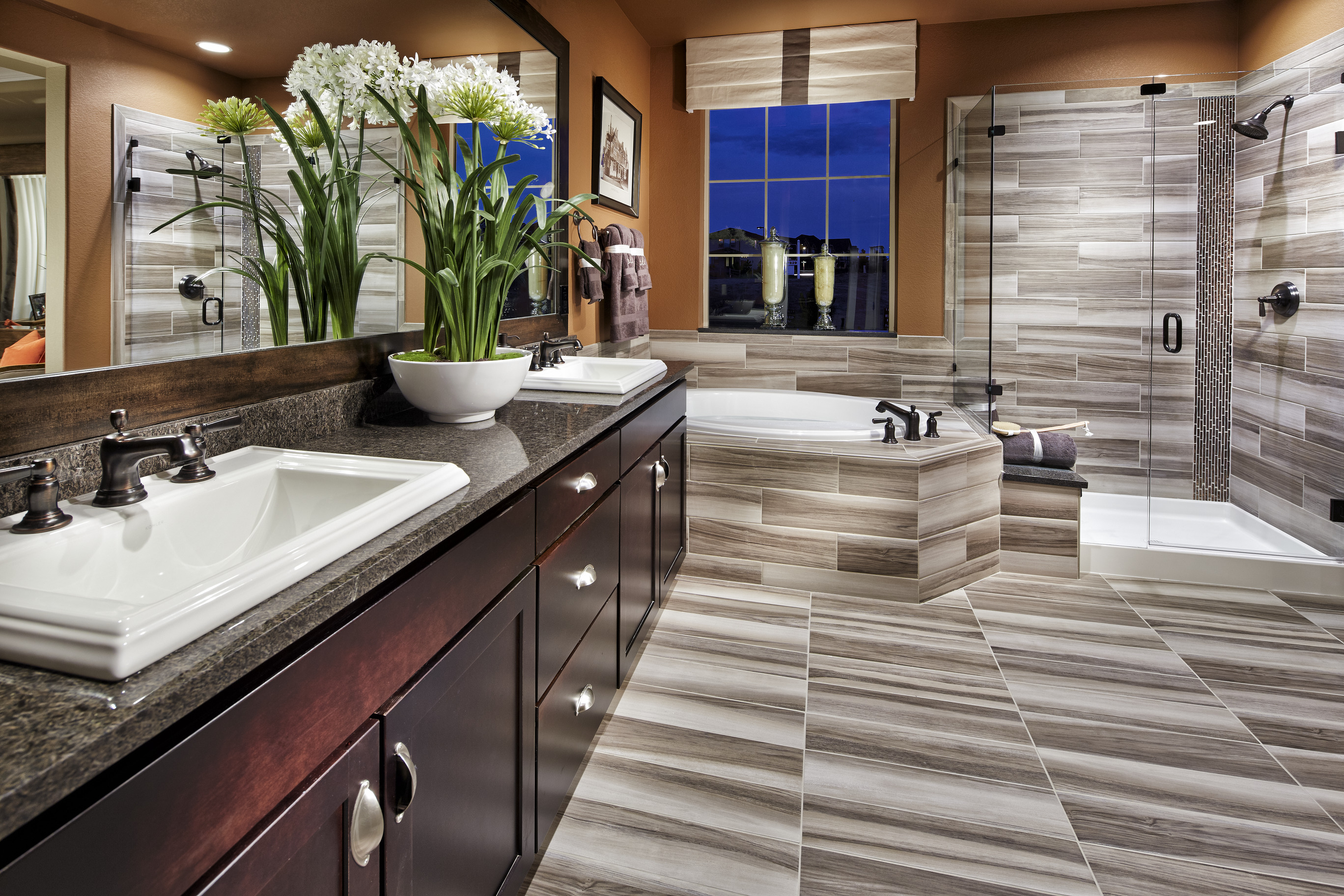 Vibrant bathroom with multicolored floor and siding tiles.