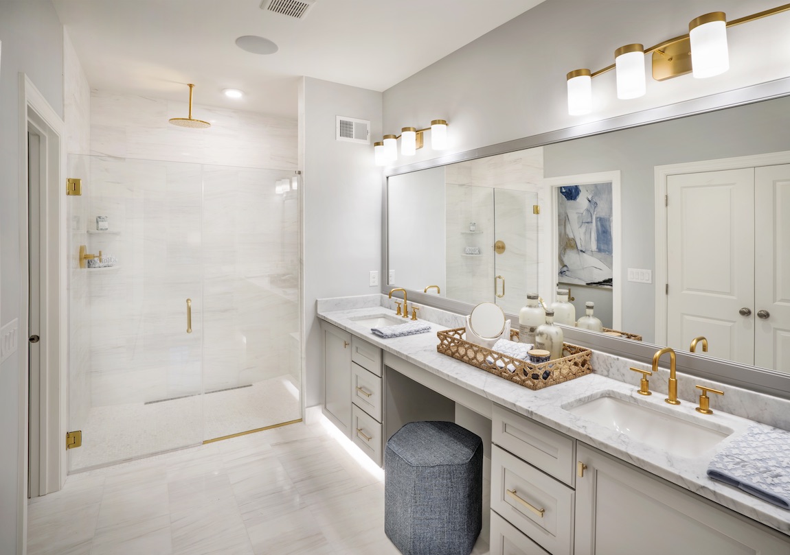 Simple gold accents in white bathroom.