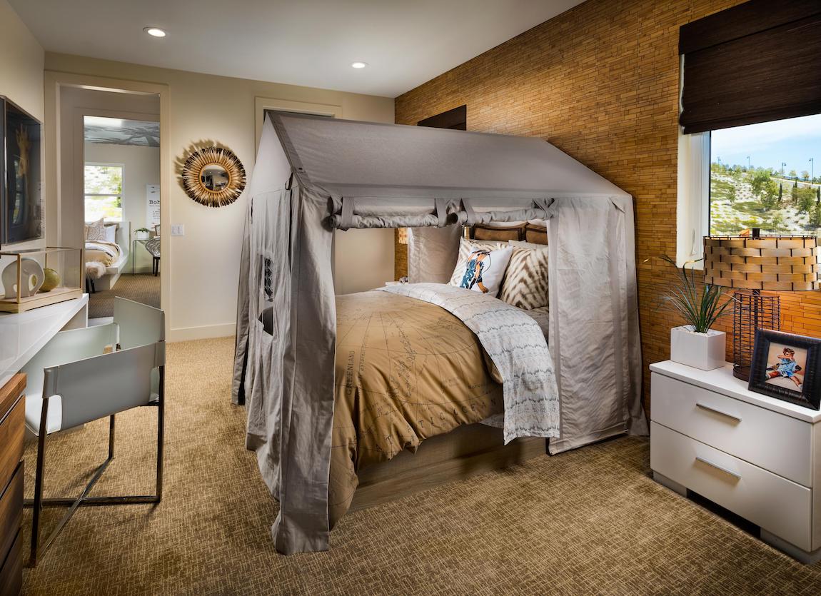 Explorer themed teen bedroom highlighted by canopy bed design