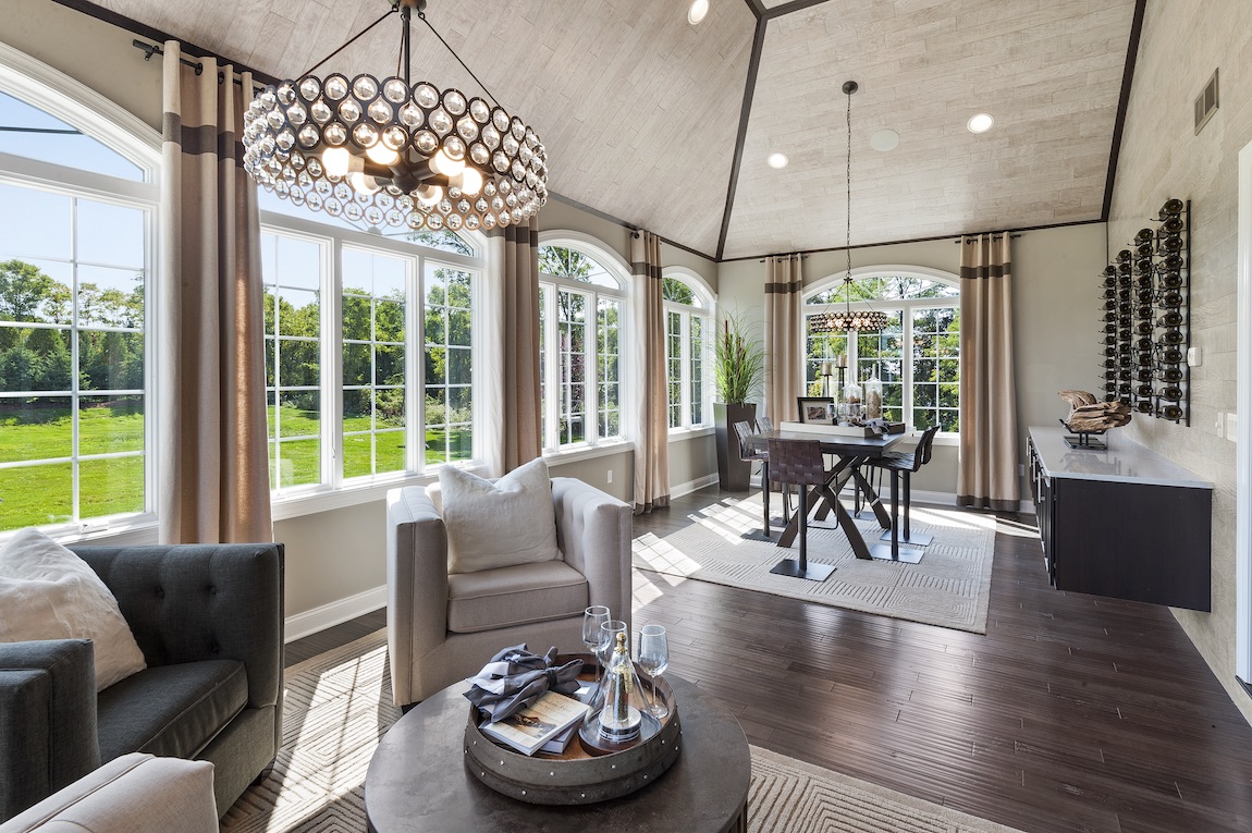 Bonus room turned recreational room with seating area and desk.