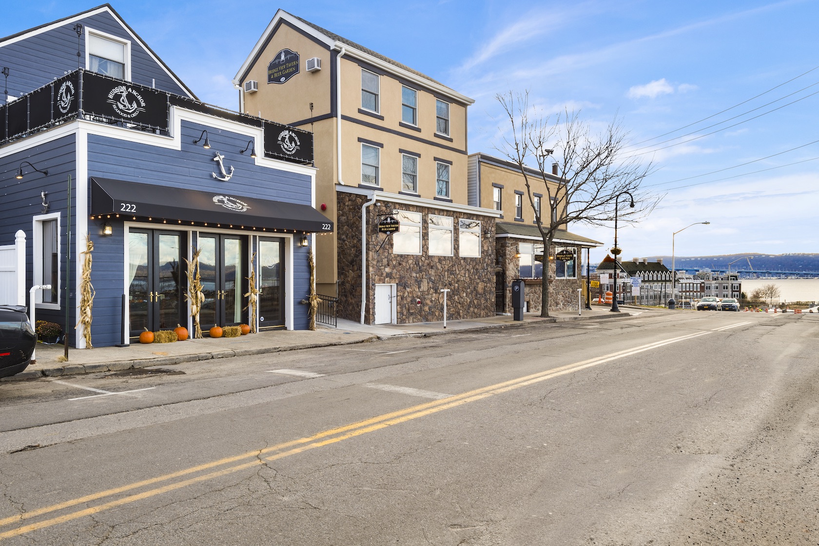 Edge on Hudson town photo with small shops by the water