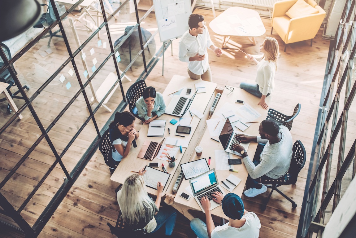 Top view of multiracial young creative people in modern office.