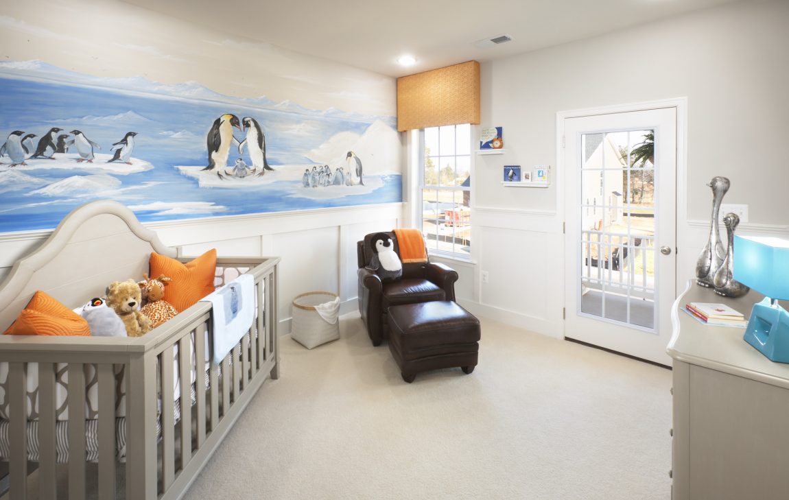 Nursery featuring crib that transitions into toddler bed.